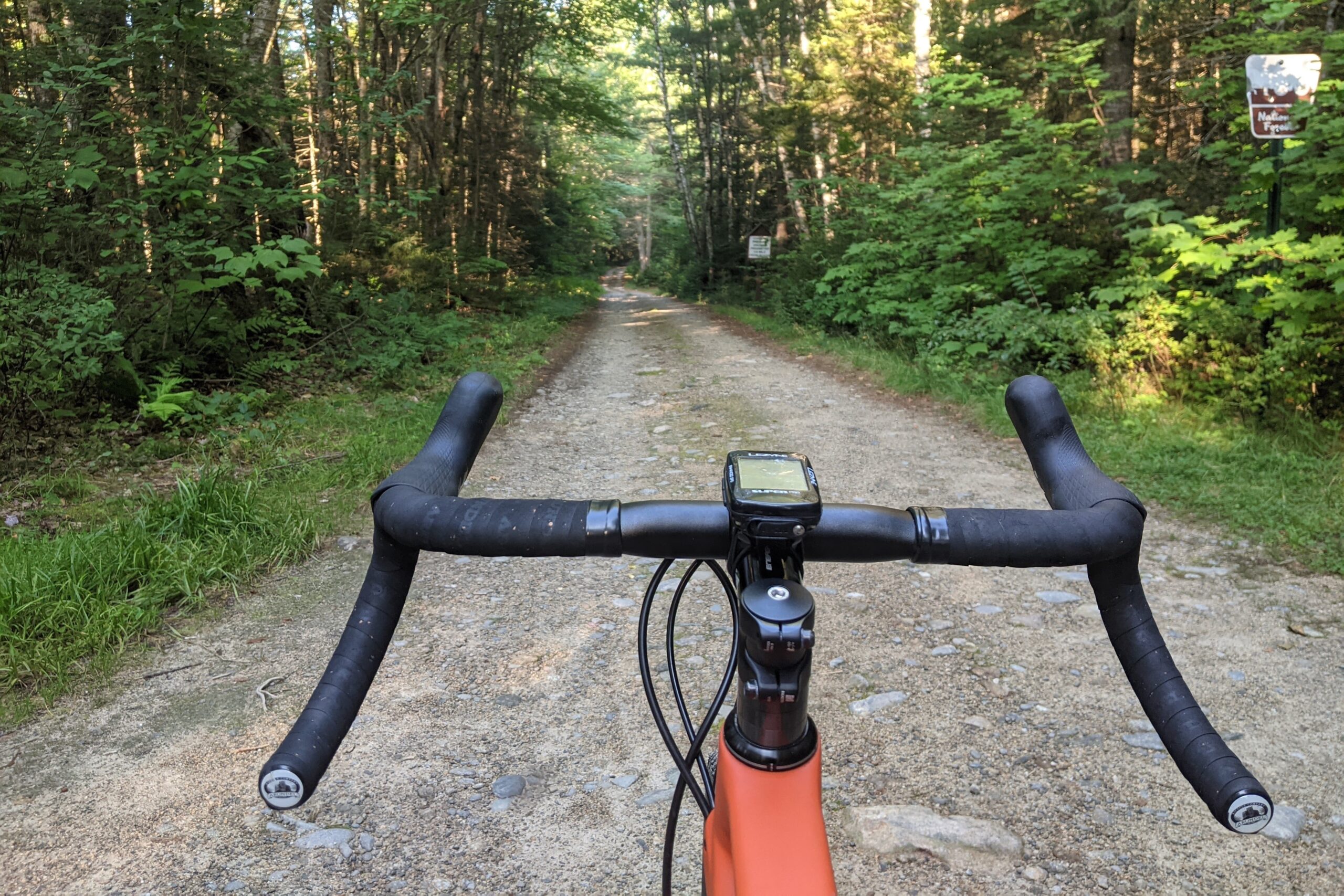 Looking over the handlebars at a gravel road